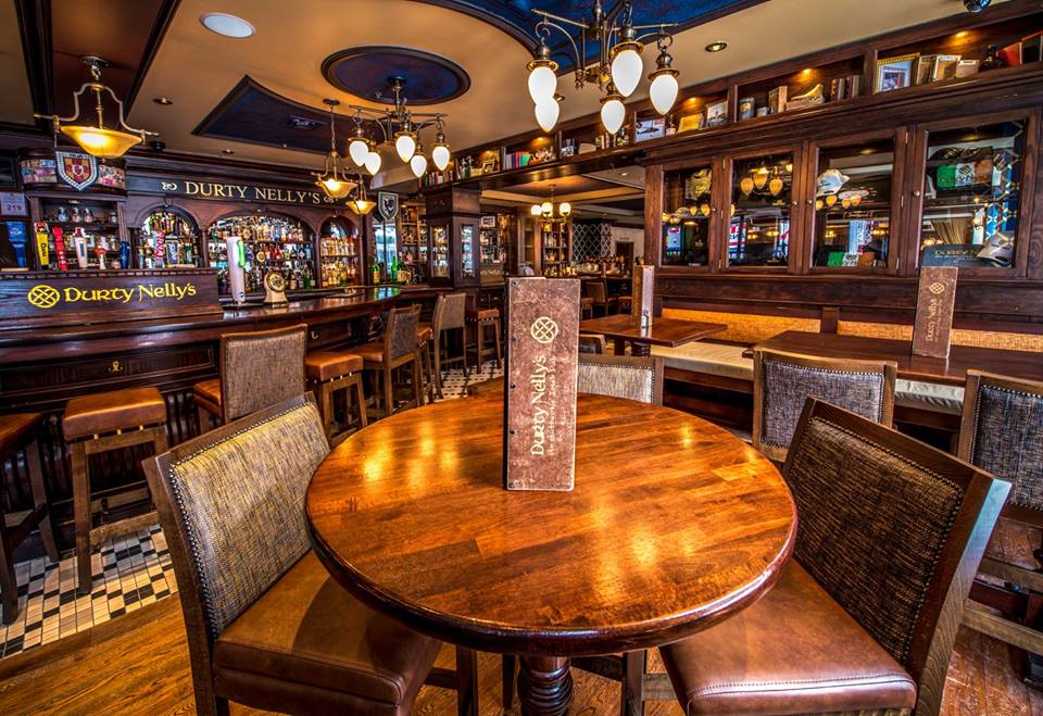 Custom built bar, tables and chairs. Designed by us at Irish Pub Company