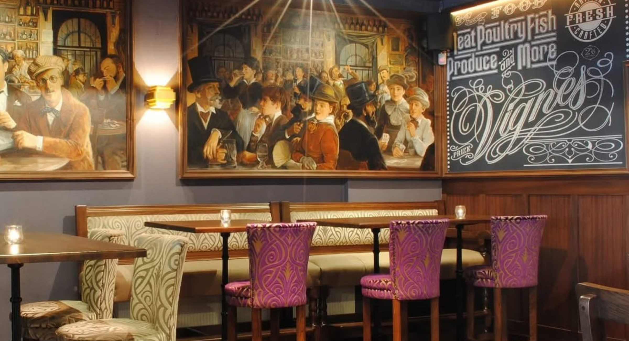 Shannigan's Gastro Pub interior with vintage tavern murals and patterned booth seating.