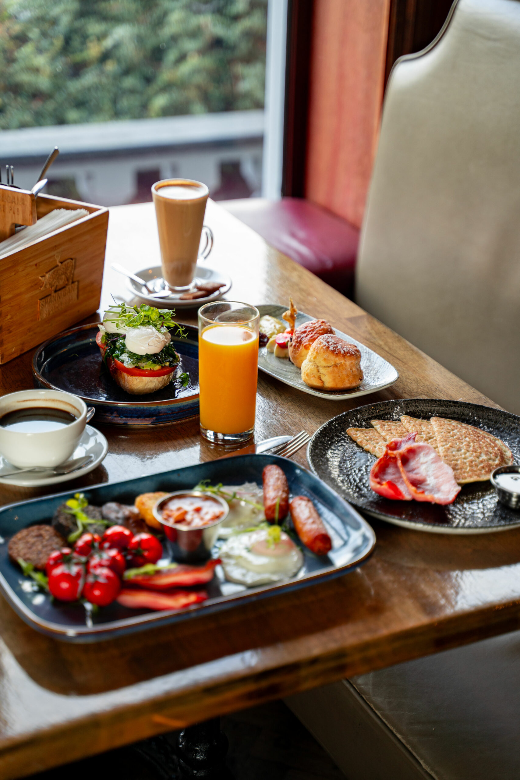 Full Irish breakfast spread at Shannigan's Gastro Pub with sausages, eggs, and fresh coffee.